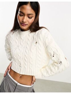 laddered cable knit sweater in ecru