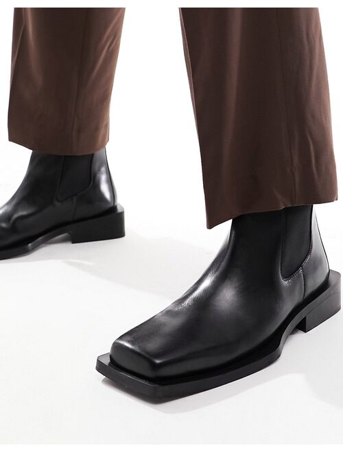 ASOS DESIGN Chelsea boots in black leather with angled sole