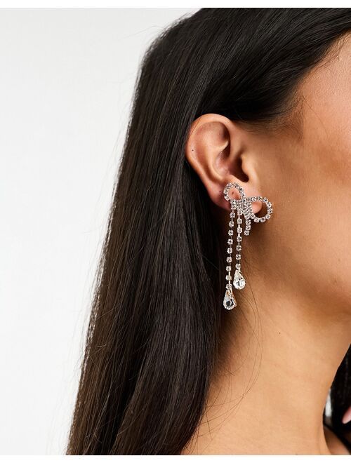 True Decadence bow waterfall earrings with crystal drop in silver and gold