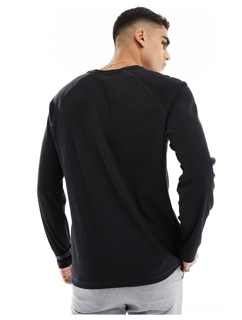 ASOS DESIGN long sleeve relaxed fit rib raglan t-shirt in black
