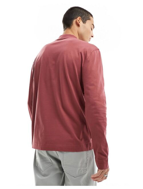 ASOS DESIGN long sleeved turtle neck t-shirt with pocket detail in washed burgundy