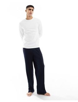 pajama set with long sleeve white T-shirt and ribbed navy bottoms