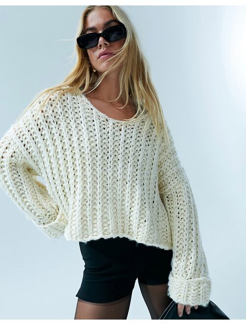 ASOS DESIGN hand knit sweater in chunky stitch with turn back cuffs in cream