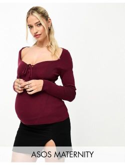 ASOS Maternity ASOS DESIGN Maternity knitted top with sweetheart neck and lace up front detail in dark red