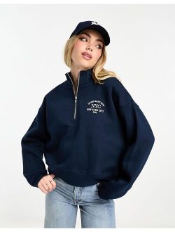 varsity half zip sweater in navy