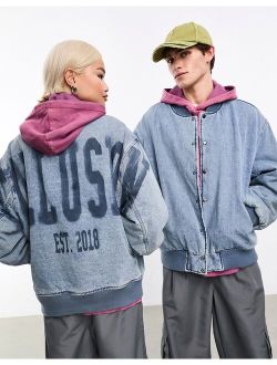 Unisex oversized denim bomber jacket with branding in blue