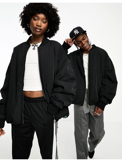 COLLUSION Unisex reversible ultimate oversized bomber jacket in black & gray tonic