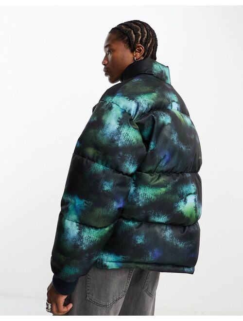 COLLUSION Unisex tie dye puffer coat in blue and black