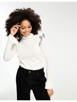 frill sleeve sweater with black contrast trim in white