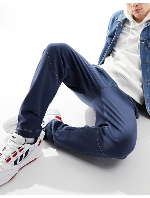 ASOS DESIGN oversized sweatpants with contrast stitching in navy