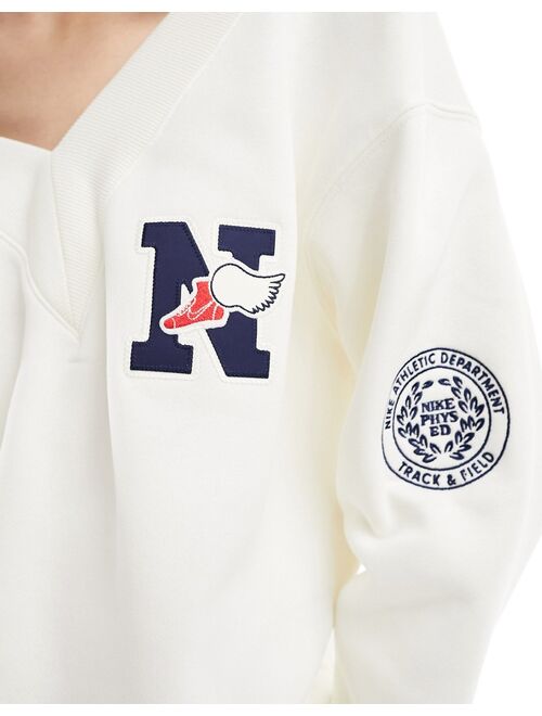 Nike Varsity v neck sweatshirt in sail white