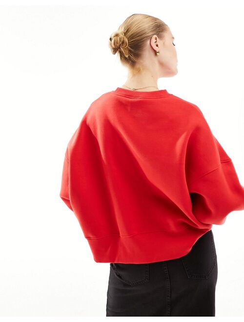 Nike unisex mini swoosh extra oversized crop fleece sweatshirt in university red