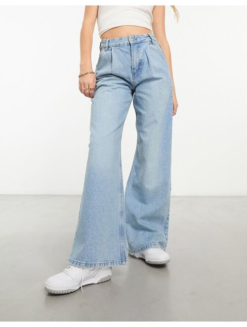 ASOS Design wide leg pleat front jean in mid blue